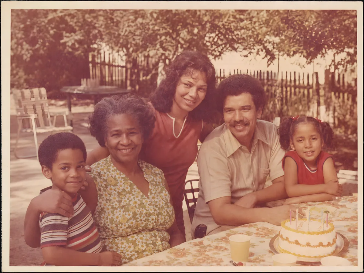 After restoration in the app: the same photo, clearer with less yellow cast